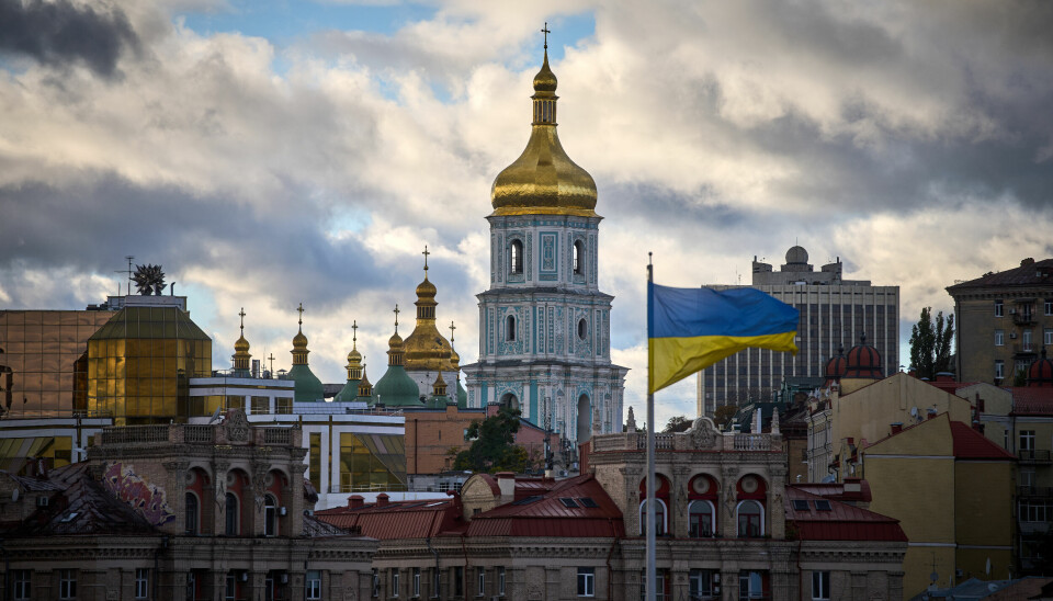 Ukrainian national flags waves on Independence square against the background of ancient St.Sophia Cathedral in central Kyiv, Ukraine, Monday, Oct. 13, 2025. (AP Photo/Efrem Lukatsky)