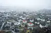 Flyfoto som viser et boligstrøk i Trondheim i grått og tåkete vær.