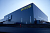 Stor industribygning med Morrow-logo på fasaden i Arendal.