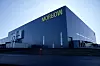 Stor industribygning med Morrow-logo på fasaden i Arendal.