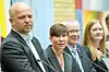 Fire personer står ved mikrofoner i vandrehallen på Stortinget under en pressekonferanse.