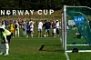 Fotballbane på Ekeberg under Norway Cup, med mål, nett og tilskuere langs sidelinjen.