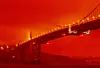 In this photo provided by Frederic Larson, the Golden Gate Bridge is seen at 11 a.m. PT, Wednesday, Sept. 9, 2020, in San Francisco, amid a smoky, orange hue caused by the ongoing wildfires. (Frederic Larson via AP)