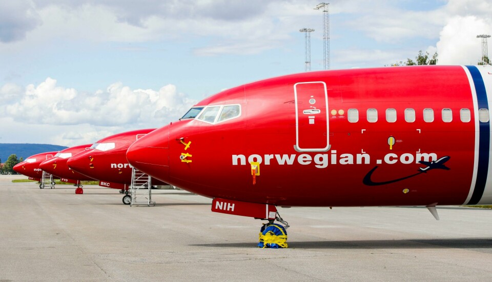 STREIK: Piloter i selskapet Norwegian kan bli tatt ut i streik. Bildet viser fire parkerte fly fra Norwegian. Foto: Vidar Ruud / NTB/ NPK