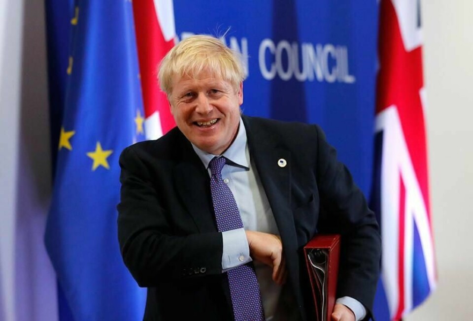 AVTALE: Boris Johnson smilte da avtalen om brexit var klar. Men det kan bli vanskelig å få Parlamentet i Storbritannia til å godkjenne den.