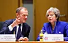 British Prime Minister Theresa May, right, and European Council President Donald Tusk attend a round table meeting at an EU summit in Brussels, Sunday, Nov. 25, 2018. European Union leaders are gathering to seal an agreement on Britain's departure from the bloc next year, the first time a member country will have left the 28-nation bloc. (Olivier Hoslet, Pool Photo via AP)