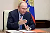Bildet viser president Vladimir Putin holder sin årlige tale til de to kamrene i nasjonalforsamlingen dagen før Føderasjonsrådet holder sitt ekstraordinære møte.