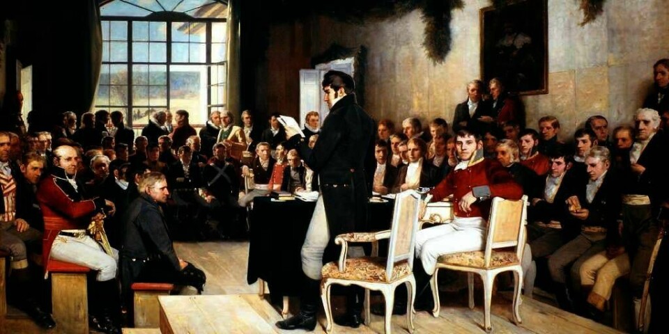 LOV: Dette bildet er malt av Oscar Arnold Wergeland. Han malte det 70 år etter at grunnloven ble underskrevet. Bildet ble gitt i gave til Stortinget i 1885. Nå vil forskere lete etter slektningene til Eidsvolls-mennene.