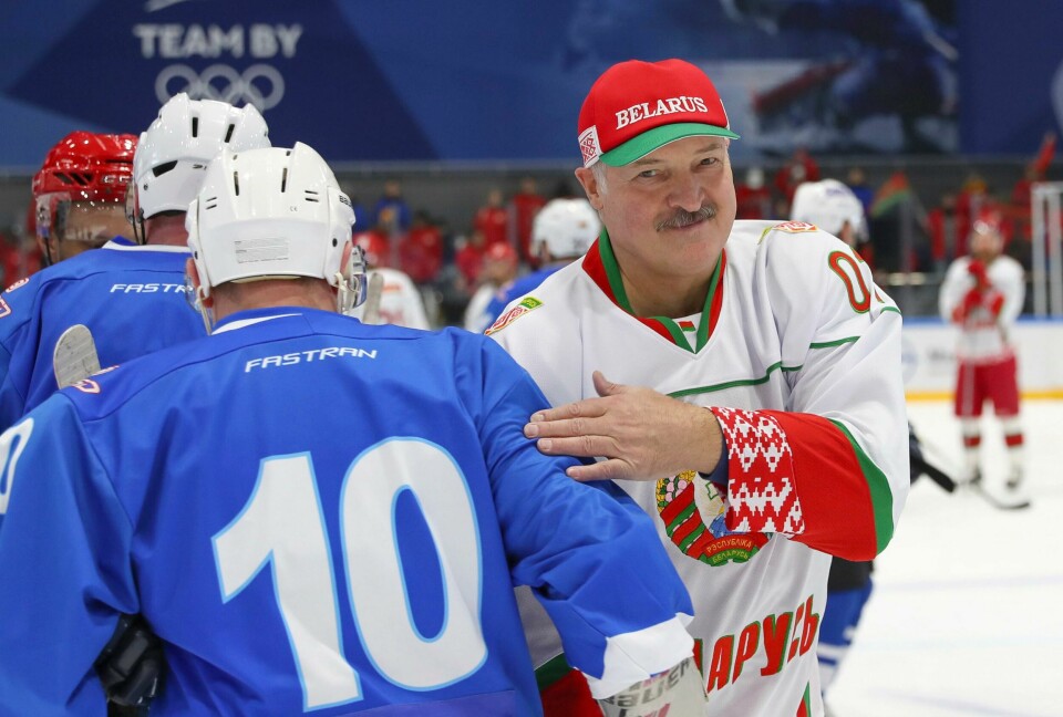 Belarusian President Alexander Lukashenko, right, takes part in a hockey match during Republican amateur competitions in Minsk, Belarus, Saturday, April 4, 2020. Amid concern about the coronavirus pandemic, Belarus' president made a public appearance in protective gear much different from the face masks and hazmat suits seen around the world. The new coronavirus causes mild or moderate symptoms for most people, but for some, especially older adults and people with existing health problems, it can cause more severe illness or death. (Andrei Pokumeiko/BelTA Pool Photo via AP) Belarusian President Alexander Lukashenko, right, takes part in a hockey match during Republican amateur competitions in Minsk, Belarus, Saturday, April 4, 2020. Amid concern about the coronavirus pandemic, Belarus' president made a public appearance in protective gear much different from the face masks and hazmat suits seen around the world. The new coronavirus causes mild or moderate symptoms for most people, but for some, especially older adults and people with existing health problems, it can cause more severe illness or death. (Andrei Pokumeiko/BelTA Pool Photo via AP)