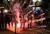 Fireworks go off in front of police, who with protesters in front of police headquarters in St. Louis on Monday, June 1, 2020. The small group of protesters was originally part of a much larger group demonstrating earlier in the afternoon against the death of George Floyd. (Colter Peterson/St. Louis Post-Dispatch via AP)