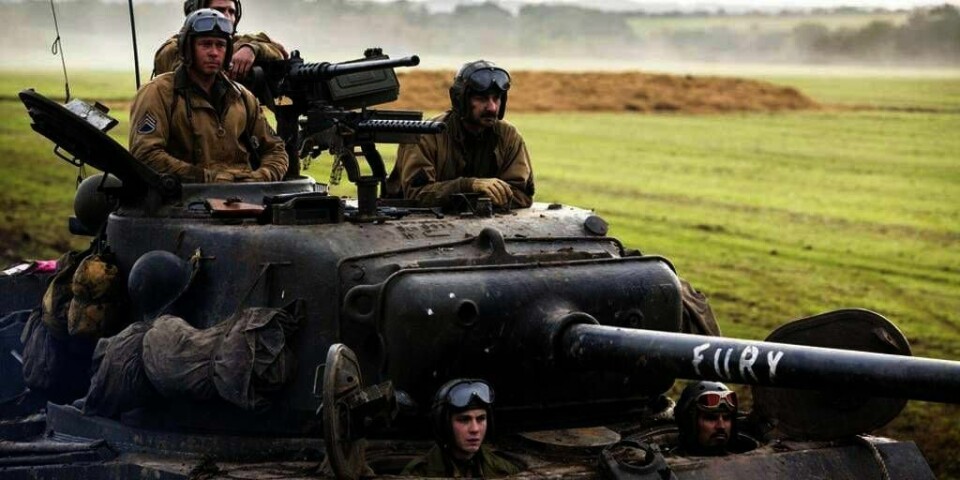 KRIG: Brad Pitt med soldater i en stridsvogn. De spiller i filmen «Fury». Den har premiere i kveld (fredag).