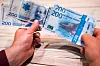Bildet viser en ny og en gammel 200-lapp.