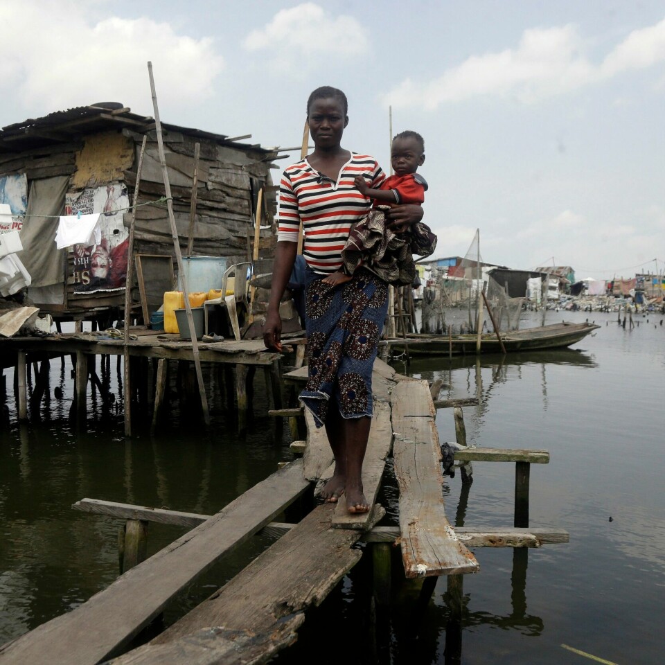 KYSTBY: Flom er allerede et stort problem i byen Lagos. Innbyggere i slumområdet Oworonshoki i gigantbyen Lagos i Nigeria. Illustrasjonsbilde: Sunday Alamba / AP / NTB