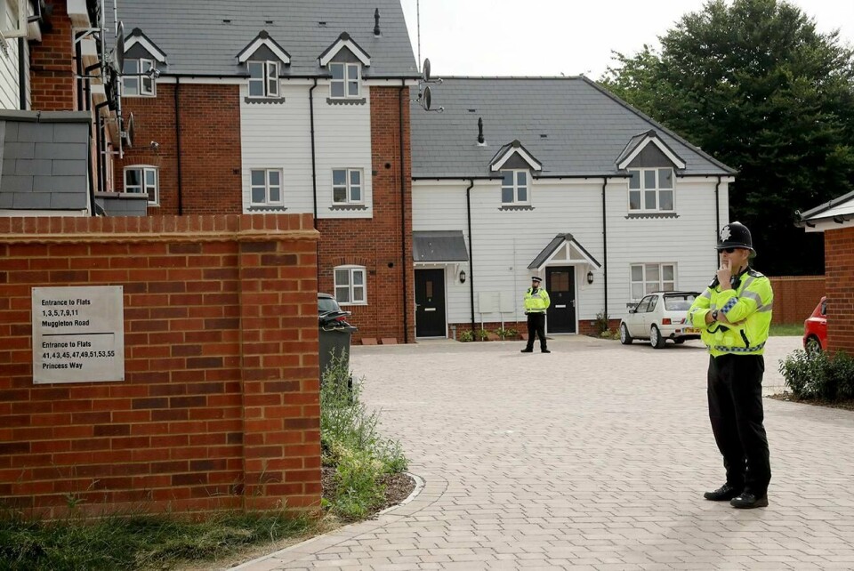 British police officers stand outside a residential property in Amesbury, England, Wednesday, July 4, 2018. British police have declared a 'major incident' after two people were exposed to an unknown substance in the town, and are cordoning off various places the people are known to have visited in the area before falling ill. (AP Photo/Matt Dunham)