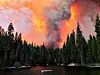 Smoke from the Creek Fire billows beyond a ridge as seen from Huntington Lake on Saturday, Sept. 5, 2020, at Huntington Lake, Calif. (Eric Paul Zamora/The Fresno Bee via AP)