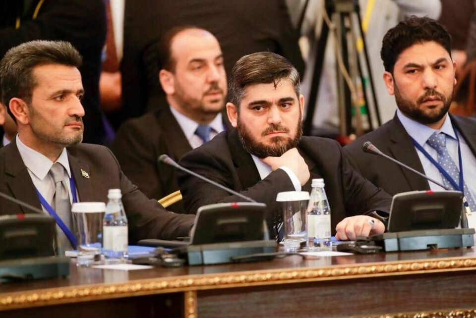 MØTE: Mohammed Alloush er leder for opprørerne i Syria. Han deltar på møtet om fred i landet.