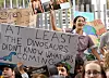 Schoolchildren hold up placards in a climate protest outside the ruling Liberal Party headquarters in Melbourne on May 3, 2019. - Students held protests in front of numerous offices of politicians up for re-election ahead of the May 18 general election to highlight the inadequate progress on addressing climate change across Australia. (Photo by William WEST / AFP)