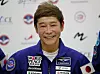 FILE - Space flight participant Yusaku Maezawa attends a news conference ahead of the expedition to the International Space Station at the Gagarin Cosmonauts' Training Center in Star City outside Moscow, Russia, on Oct. 14, 2021. Maezawa said Friday, Dec. 9, 2022 that K-pop star TOP will be among the eight crew members who will join him on a flyby around the moon on a SpaceX spaceship next year. (Shamil Zhumatov/Pool Photo via AP, File)