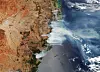 Bildet er tatt av en satellitt. Den viser røyk fra skogbranner i Australia.