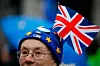 An anti-Brexit protester is seen in Parliament square in front of the Houses of Parliament in London on January 30, 2020. - Britain will leave the European Union formally at 2300GMT on January 31, 2020. (Photo by Tolga AKMEN / AFP)