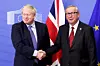 epa07927451 President of the European Comission Jean-Claude Juncker (R) and British Prime Minister Boris Johnson shake hands during a press conference on the Brexit deal in Brussels, Belgium, 17 October 2019. According to reports, the EU and the British government have reached a deal for Brexit. EPA/OLIVIER HOSLET