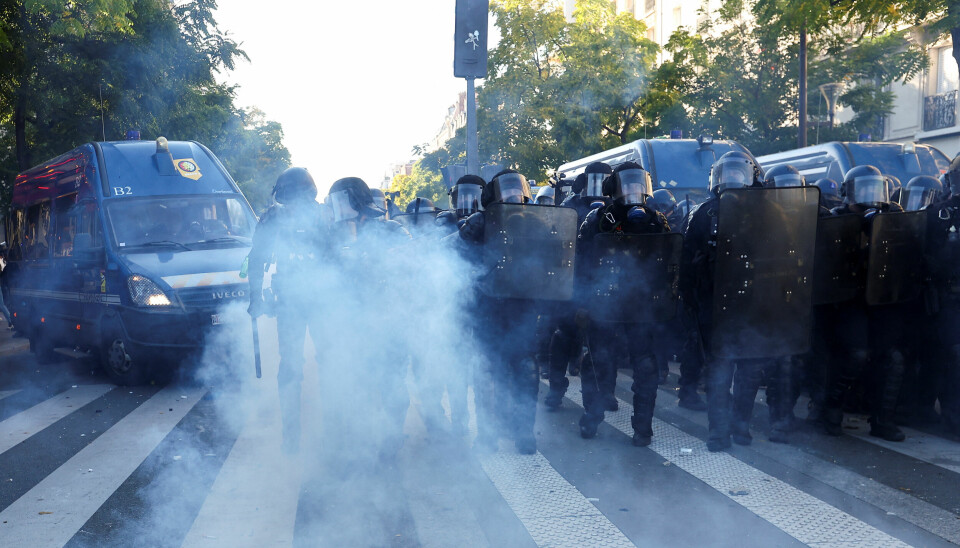 STORE PROTESTER: Frankrike opplevde store protester torsdag. Politiet møtte demonstranter med tåregass, blant annet i Paris.